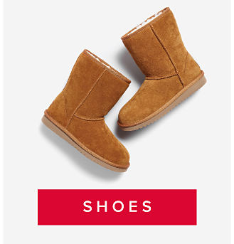 Two brown cozy boots. Shop shoes. 
