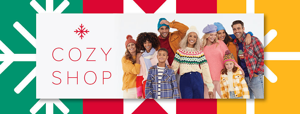 An image of a group of men, women and kids, all wearing cozy sweaters, flannel, toboggans and more. Cozy Shop.