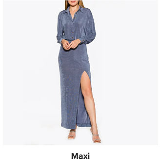 A woman in a blue maxi dress. Shop maxi dresses.