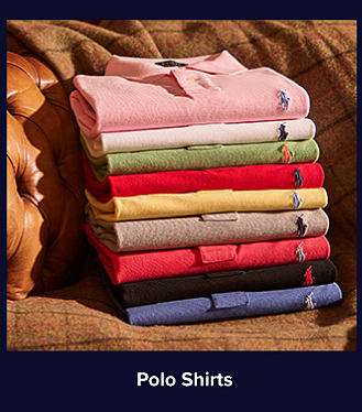 A stack of folded polo shirts in various colors. Shop polo shirts.
