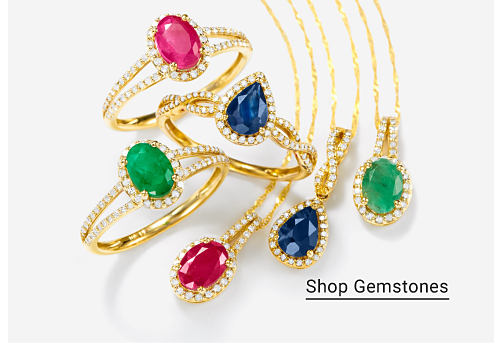 An image of multi-colored rings and necklaces. Shop gemstones.