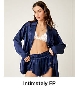 An image of a woman wearing a robe and shorts. Shop Intimately FP.