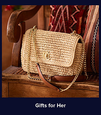 An image of a tan crossbody bag. Shop gifts for her.