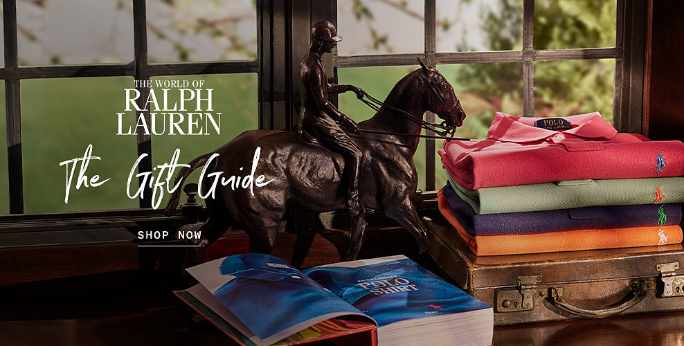 The world of Ralph Lauren. The Gift Guide. Shop now. An image of a stack of multi-colored polo shirts.