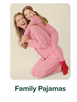 Image of a woman and young girl wearing matching pink pajamas. Family pajamas.