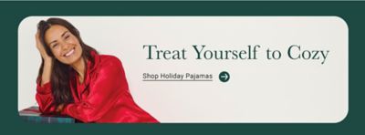 Image of woman in red pajamas. Treat yourself to cozy. Shop holiday pajamas.