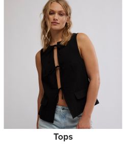 An image of a woman wearing a top. Tops.