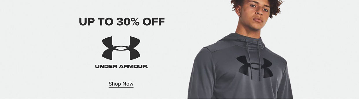 A man in a gray Under Armour shirt. Up to 30% off Under Armour. Shop now.