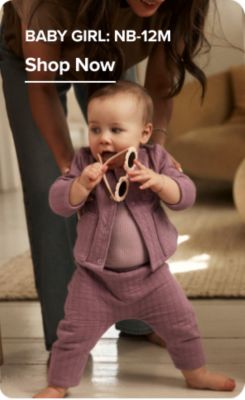 Baby girl: NB-12M. Shop now. A baby girl in a matching set.