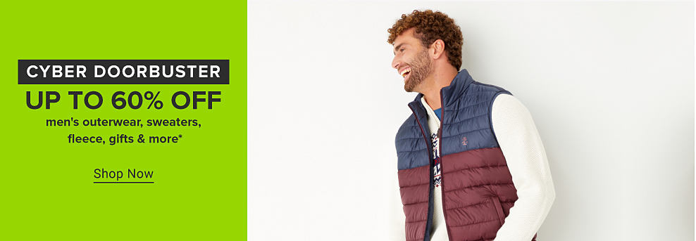 Cyber doorbuster. Man wearing a puffy red and blue vest over a white shirt. Up to 60% off mens outerwear, sweaters and more. Shop now. 