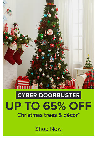 An image of a Christmas tree, presents and decor. Cyber doorbuster. Up to 65% off Christmas trees and decor. Shop now. 