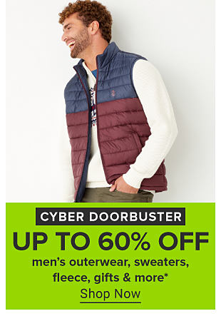 An image of a man in a red and blue vest. Cyber doorbuster. Up to 60% off men's outerwear, sweaters, fleece, gifts and more. Shop now. 