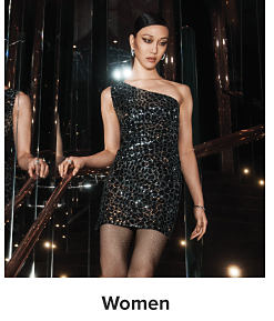 A woman in a black sparkly dress. Shop women.