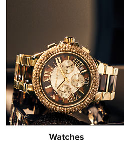 A gold Michael Kors watch with tortoise shell accents. Shop watches.