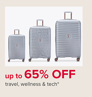 Three gray rolling suitcases. Up to 65% off travel, wellness & tech. 