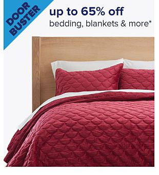 Doorbuster. Up to 65% off bedding, blankets & more. Image of a made bed. Shop now.
