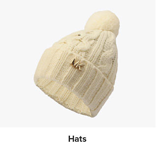 An image of a beige knit hat. Shop hats.