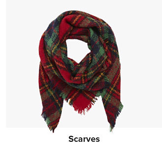 An image of a plaid red and green scarf. Shop scarves.