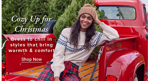 Cozy Up for Christmas Dress to chill in styles that bring warmth & comfort Shop Now Image of woman in pajamas in the back of a red truck