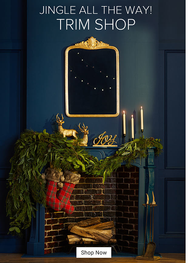 An image of a mantle and fireplace decorated with Christmas decor. Jingle all the way. Trim Shop. Shop Now. 
