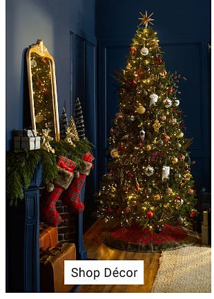 An image of a Christmas tree, stockings and decor. Shop decor. 