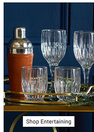 An image of a cocktail shaker and glassware. Shop entertaining. 
