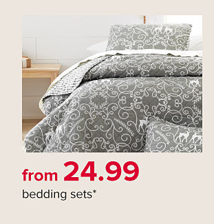A bed with green, white and red holiday bedding. From 24.99 bedding sets. 