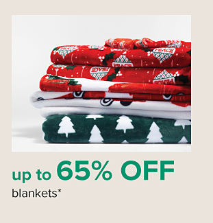 A stack of holiday themed blankets. From 19.99 blankets. 