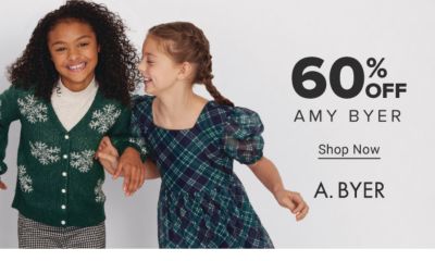 Two girls in a holiday dress and holiday sweater. 50% off A. Byer. Shop now.