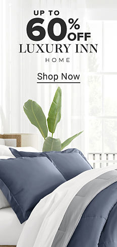 A bed with blue bedding. Up to 60% off Luxury Inn home. Shop now.