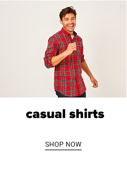 A man in a red plaid button front shirt and jeans. Casual shirts. Shop now.