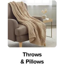 Image of a blanket on an armchair. Throws and pillows.