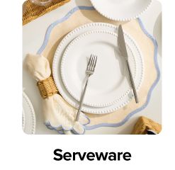 Image of a white plate on a decorative place setting. Serveware.