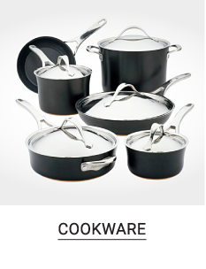 A cookware set with an assortment of black pots and pans with clear lids. Shop cookware.