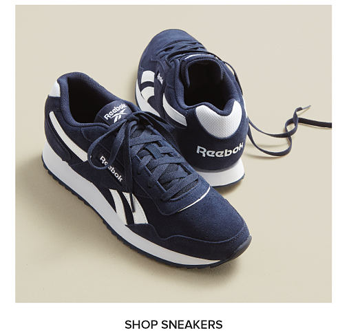 A pair of blue Reebok sneakers. Shop sneakers.