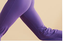 A woman running in a purple activewear set. The Active Shop. 