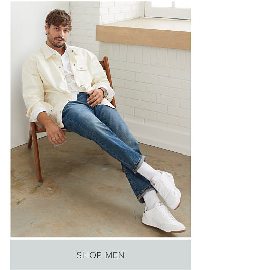 Keep it cool. Shop men. Man in white jacket and jeans.
