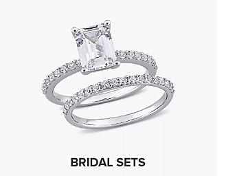 An image of a wedding ring and band. Shop bridal sets.