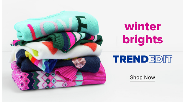 A stack of folded, brightly colored sweaters. Winter brights. Trend Edit. Shop now.
