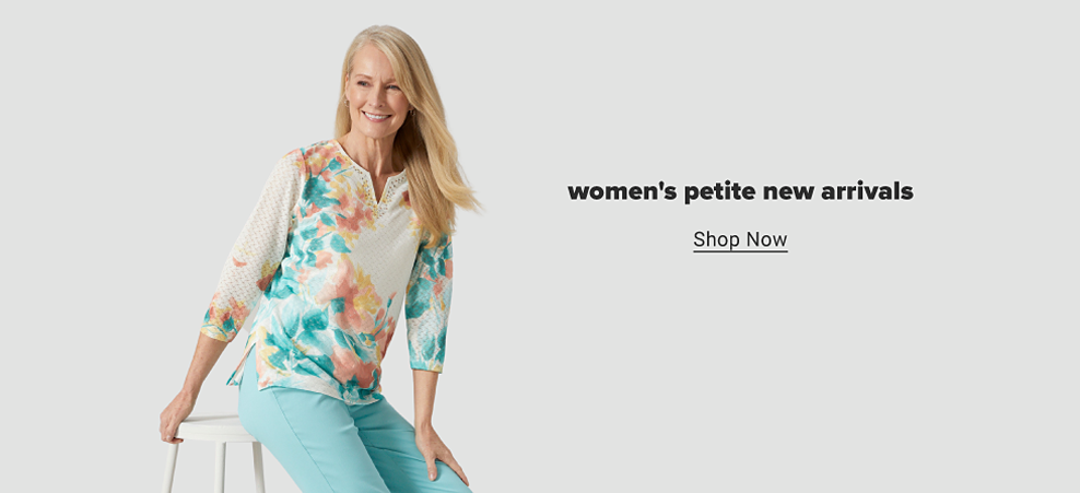 A woman in a white top with a blue, pink and yellow floral pattern and matching blue pants. Women's petite new arrivals. Shop now. 