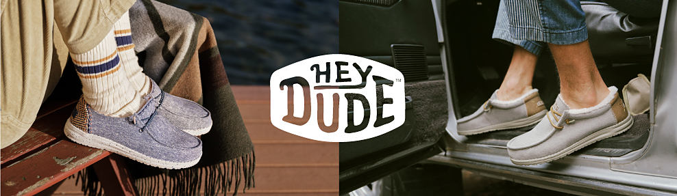 A close up of light blue Hey Dude shoes being worn on a dock. Hey Dude logo. A closeup of gray Hey Dude shoes.