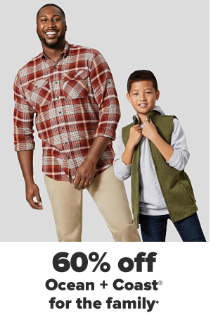 A man in a red flannel shirt and khaki pants. A little boy in a gray hoodie, an army green vest and jeans. 60% off Ocean and Coast for the family.