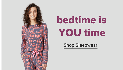 Woman in matching patterned pajama set. Bedtime is you time. Shop sleepwear. 