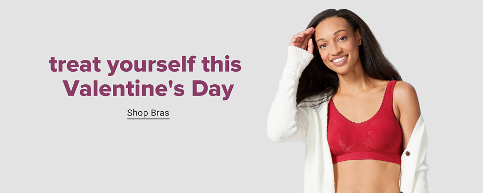Woman in red sports bra and white cardigan. Treat yourself this Valentine's Day. Shop bras. 