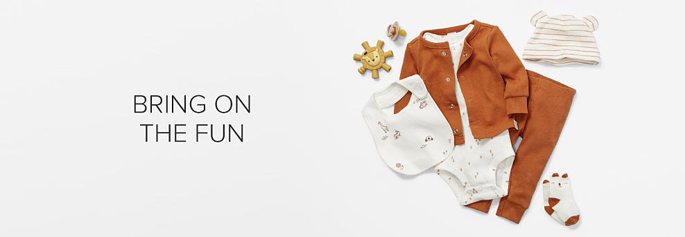 Image of a white onesie paired with orange pants, an orange cardigan, bib and hat. Bring on the fun. Shop baby girls. Shop baby boys. Shop gender neutral.