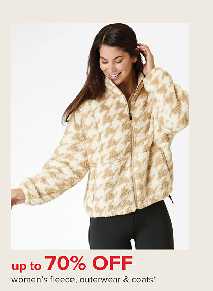 A woman in a fleece herringbone jacket. Up to 70% off women's fleece, outerwear and coats.
