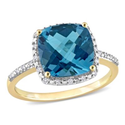 Belk & Co 5.25 Ct. T.g.w. London Blue Topaz And 1/10 Ct. T.w. Diamond Cocktail Ring In 14K Yellow Gold