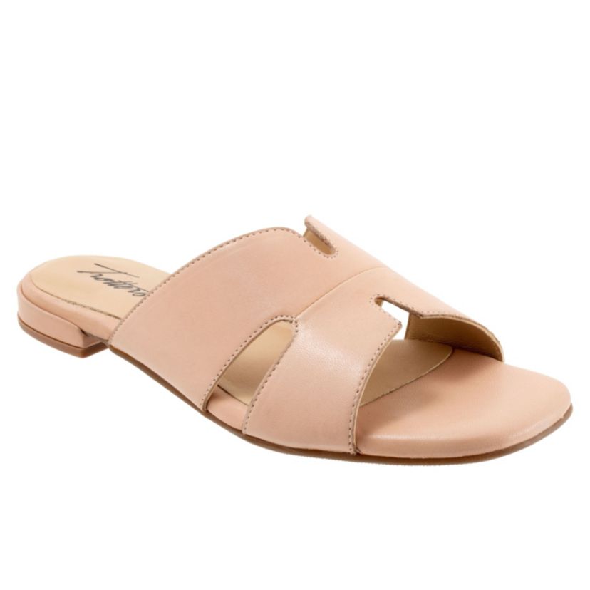 Cut outs give the Nell sandal a unique and fun style youll love. With a leather upper and soft leather lining, youll love the luxurious feel of the Nell sandal.