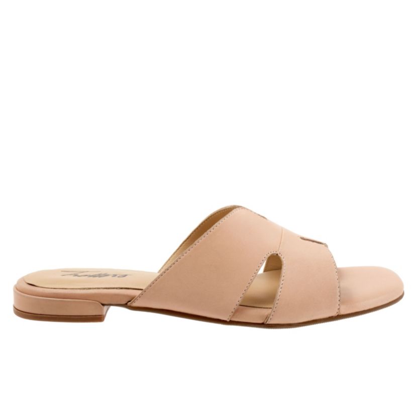 Cut outs give the Nell sandal a unique and fun style youll love. With a leather upper and soft leather lining, youll love the luxurious feel of the Nell sandal.