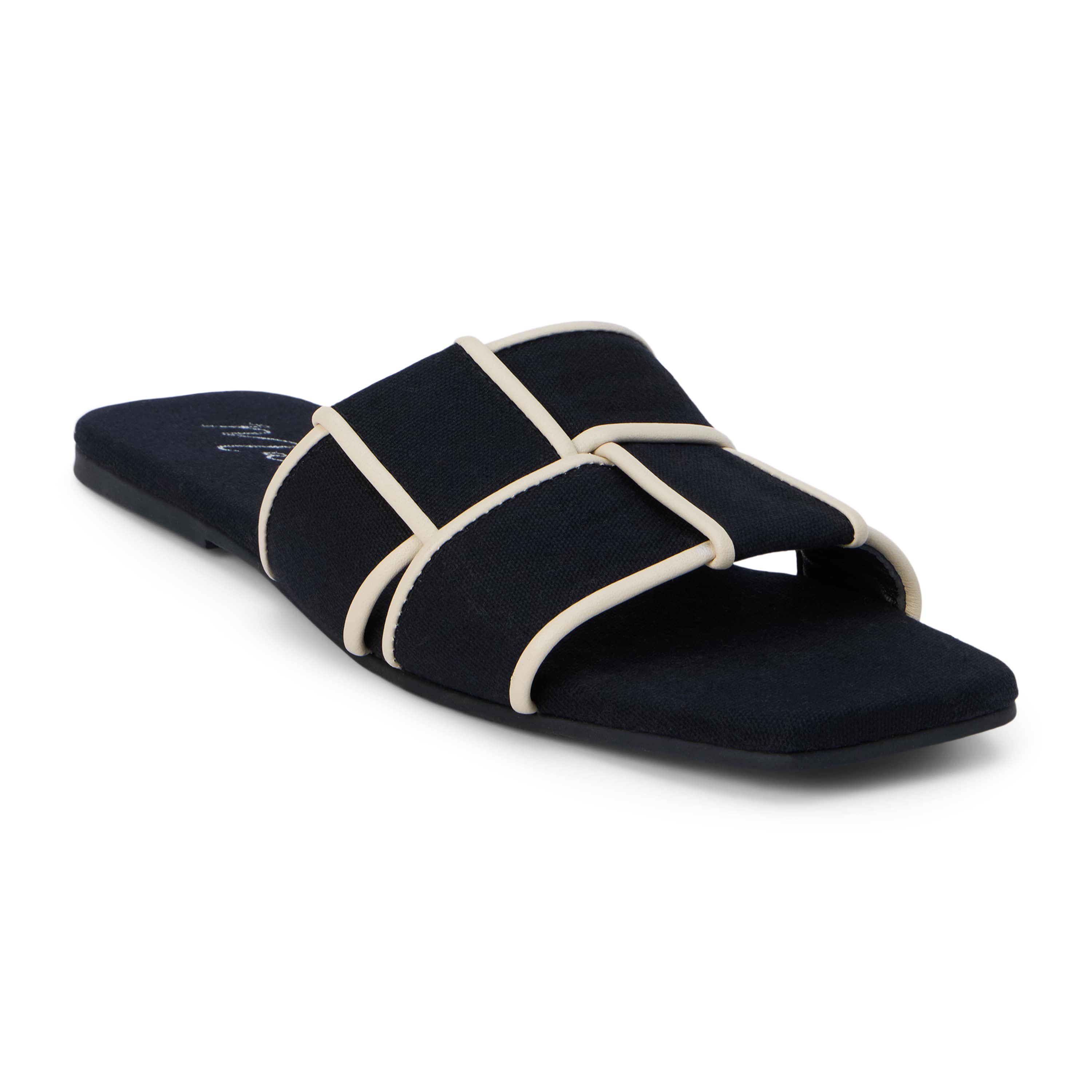 Flat sandal with woven upper.